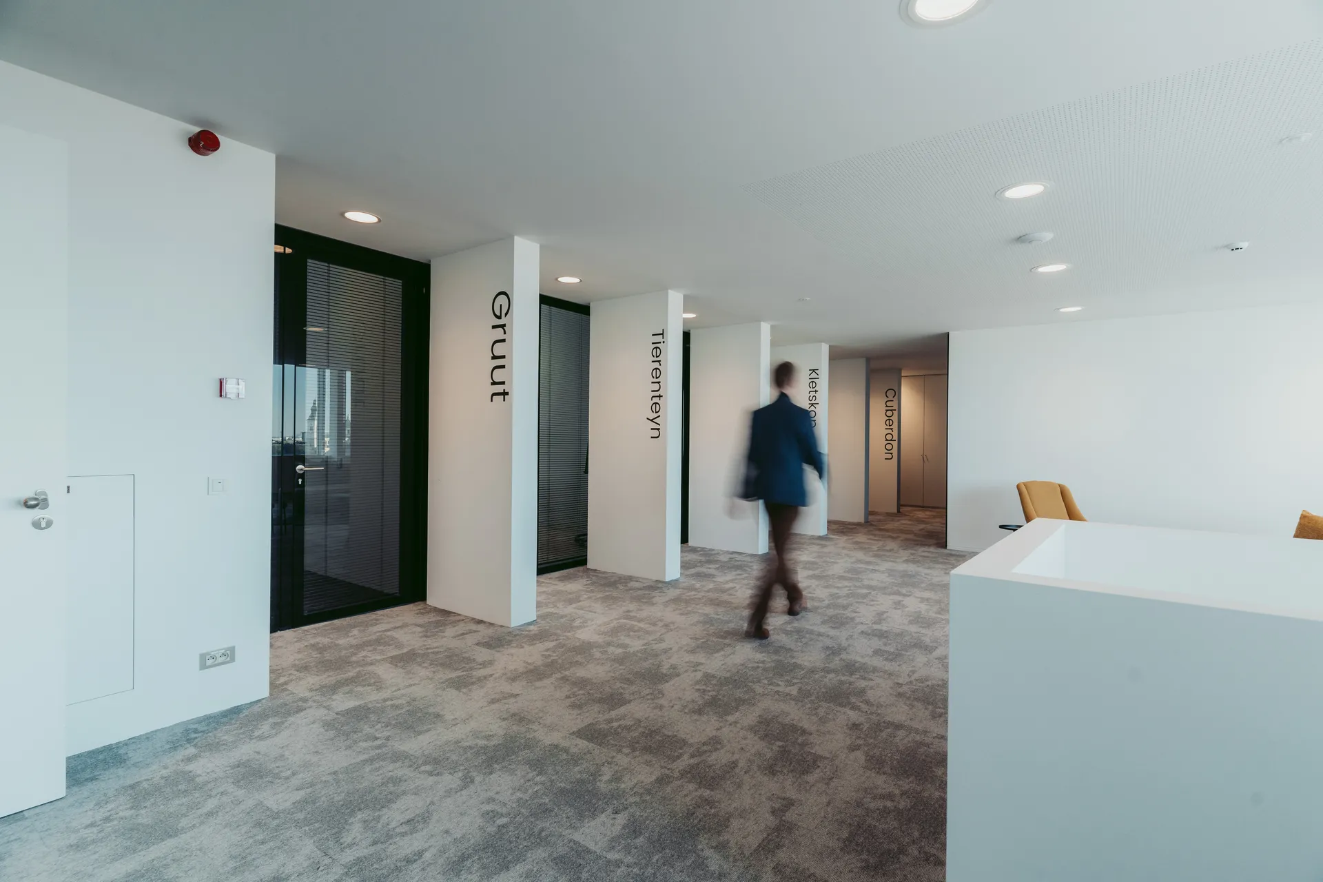 Someone walking in the Ghent Office