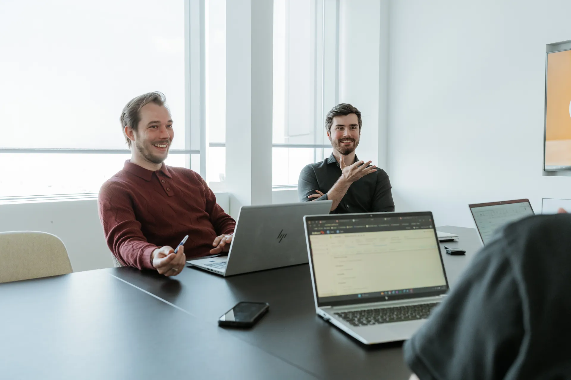 Pauwels Consulting colleagues in meeting office Ghent.