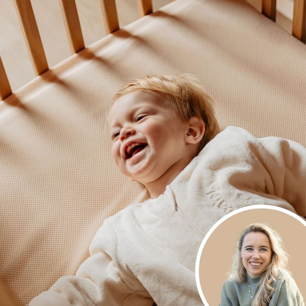 A joyful baby laughing in a crib, wearing a white Teddy Puckababy sleeping bag. A smiling woman is shown in an inset circle in the corner.