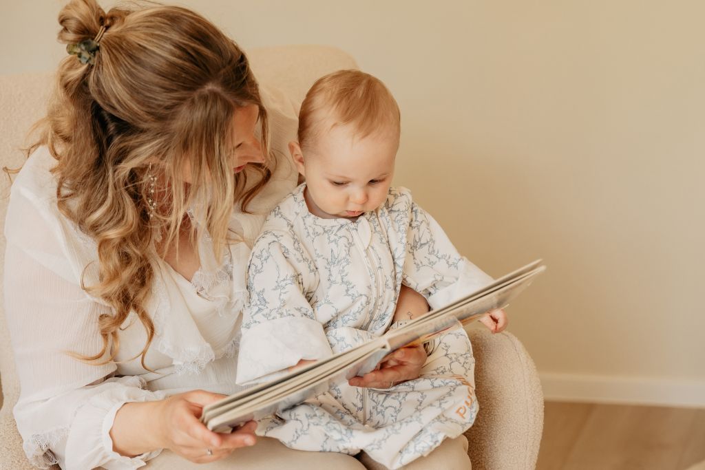Mother and baby reading a book