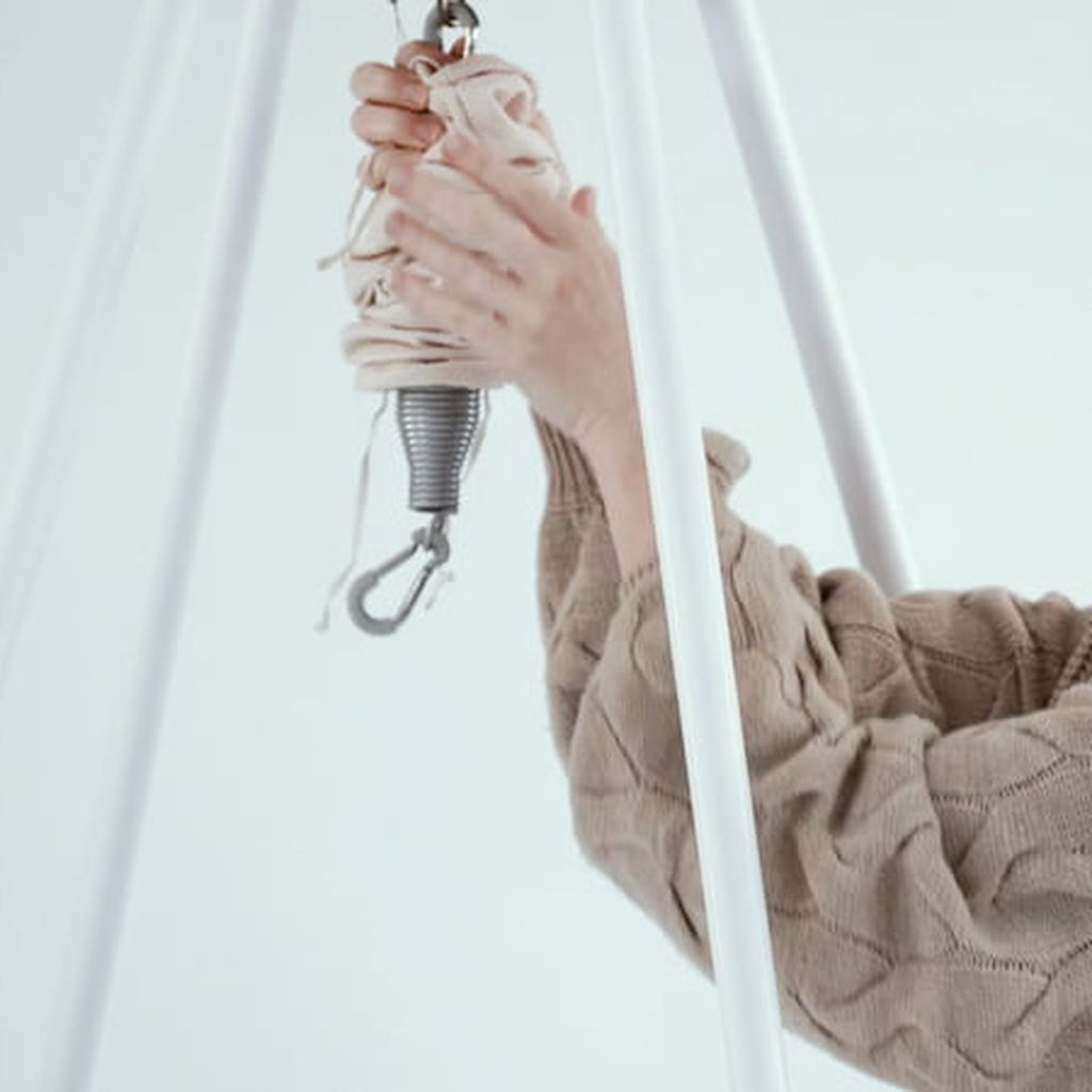 Hammock spring attached to tipi stand