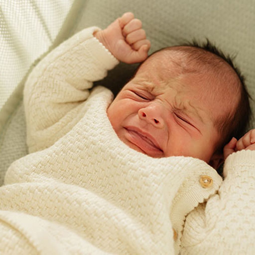 Newborn baby expressing discomfort or crying
