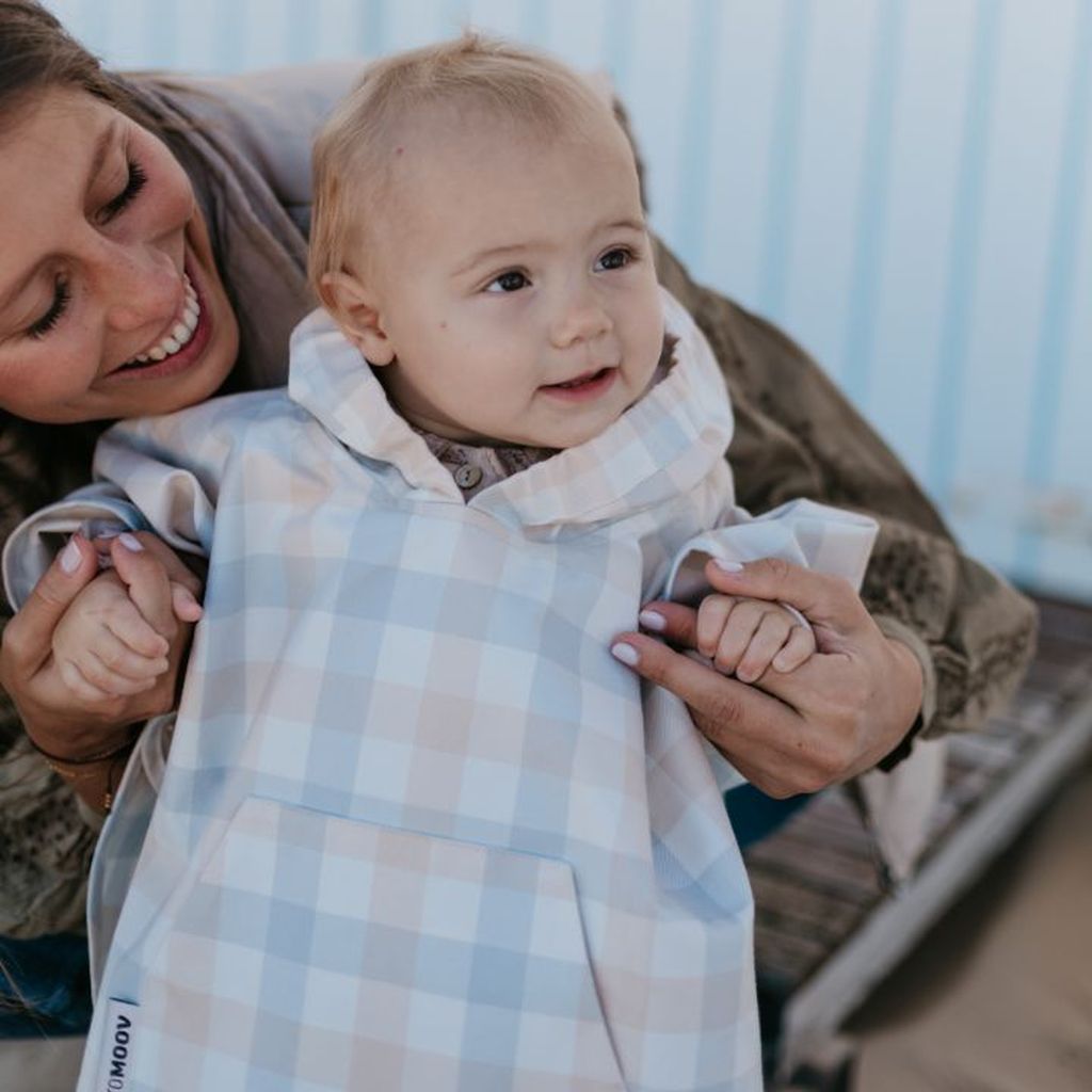 Toddler wearing a poncho