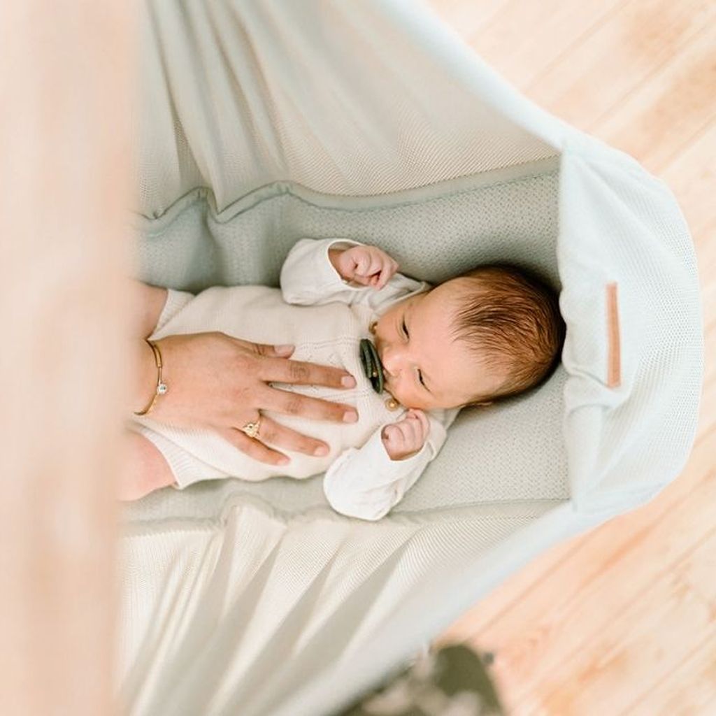 baby sleeping in hammock
