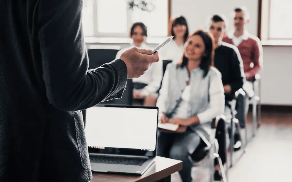 everyone-is-smiling-listens-group-people-business-conference-modern-classroom-daytime.jpg