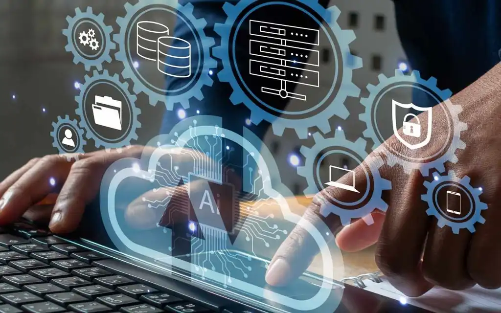 Hands typing on a keyboard with cloud and automation symbols in the air