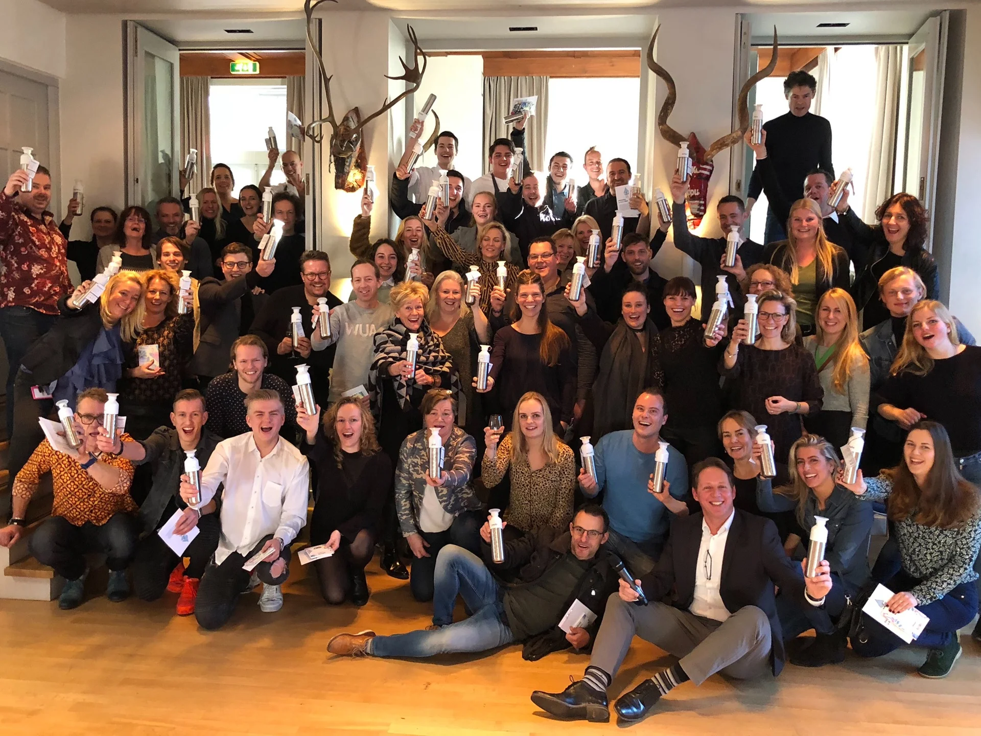 group of people with dopper bottles 