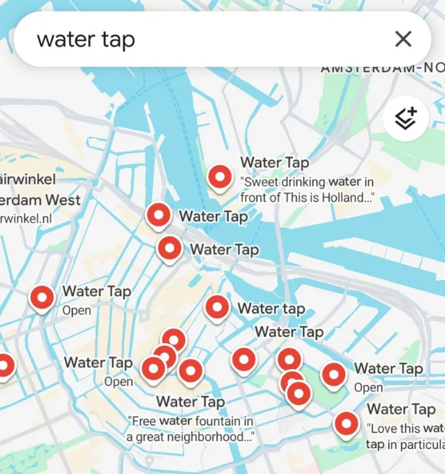 Map of Amsterdam showing multiple locations labeled as "Water Tap" with red markers and descriptions near canals.