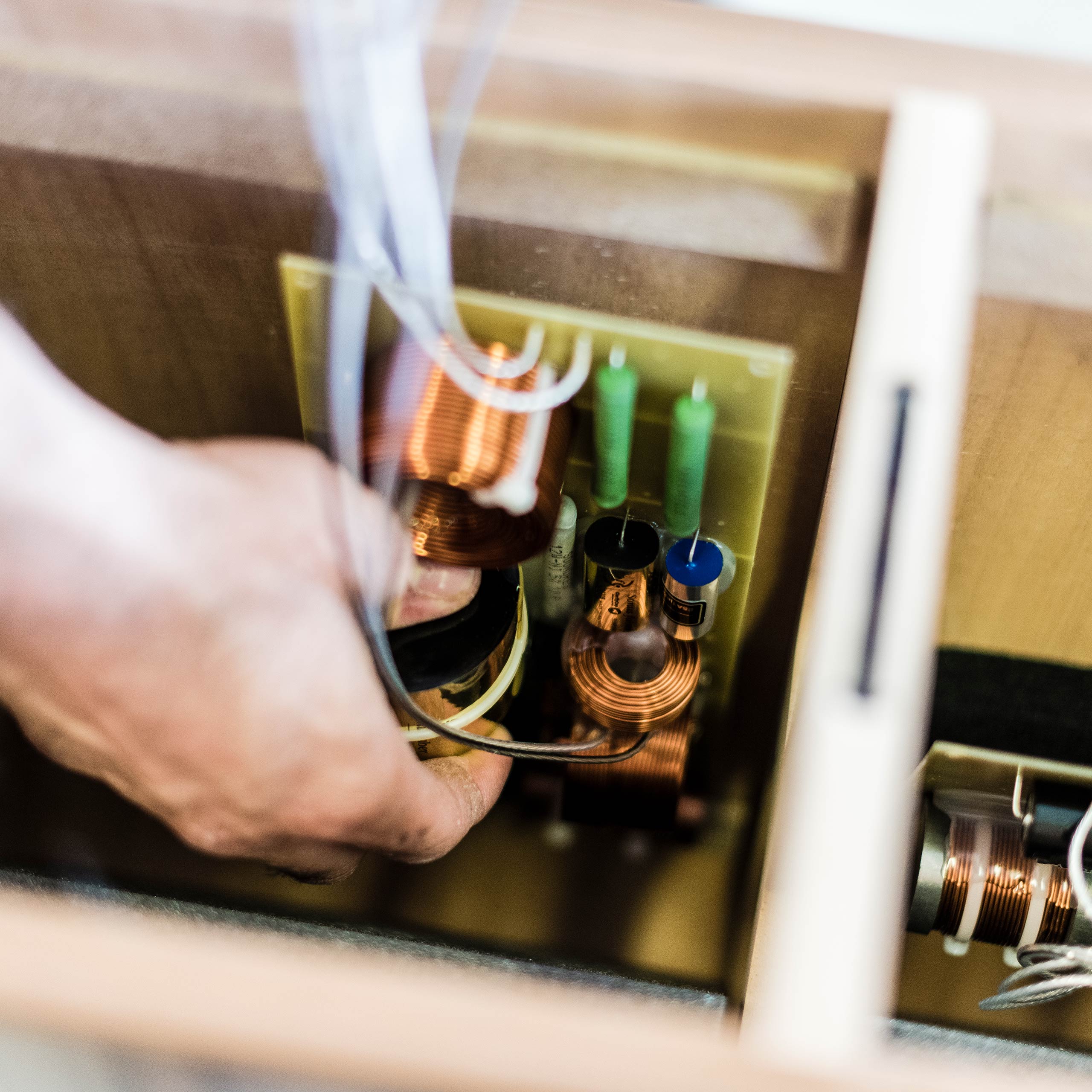 Sonus faber Italian craftsman meticulously crafting the technology on the Olympica Nova CI center channel speakers.