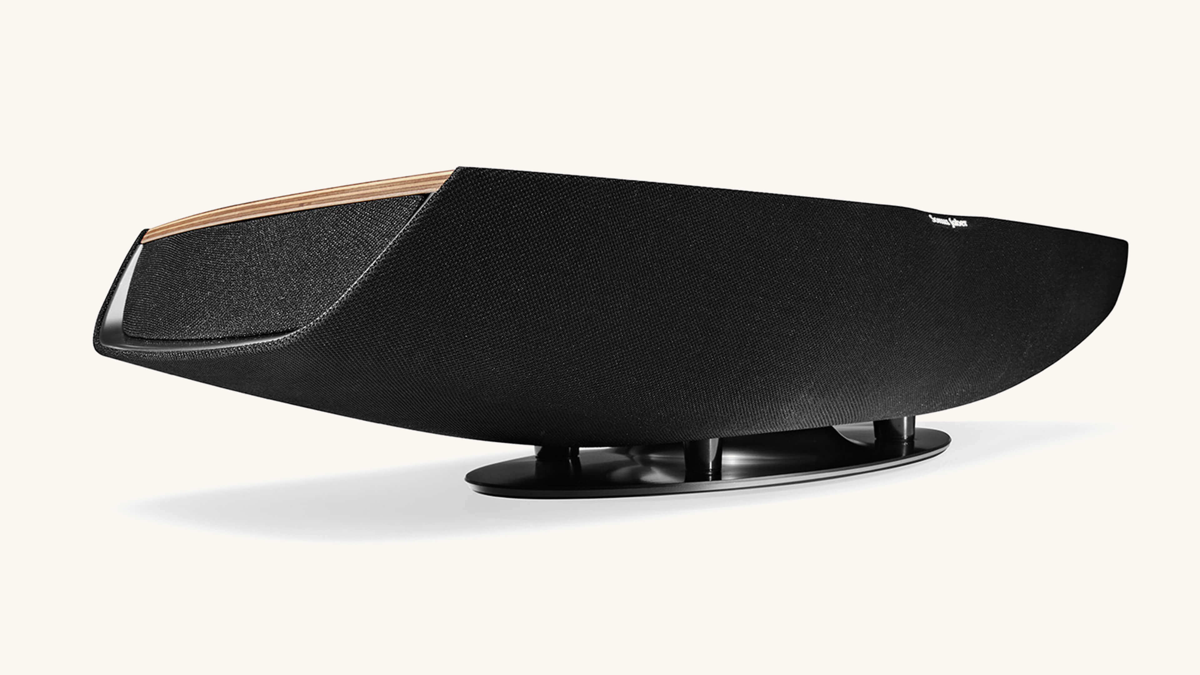 Bottom view of Sonus faber Omnia wireless bookshelf speaker in Walnut, showcasing intricate details of its unique design.