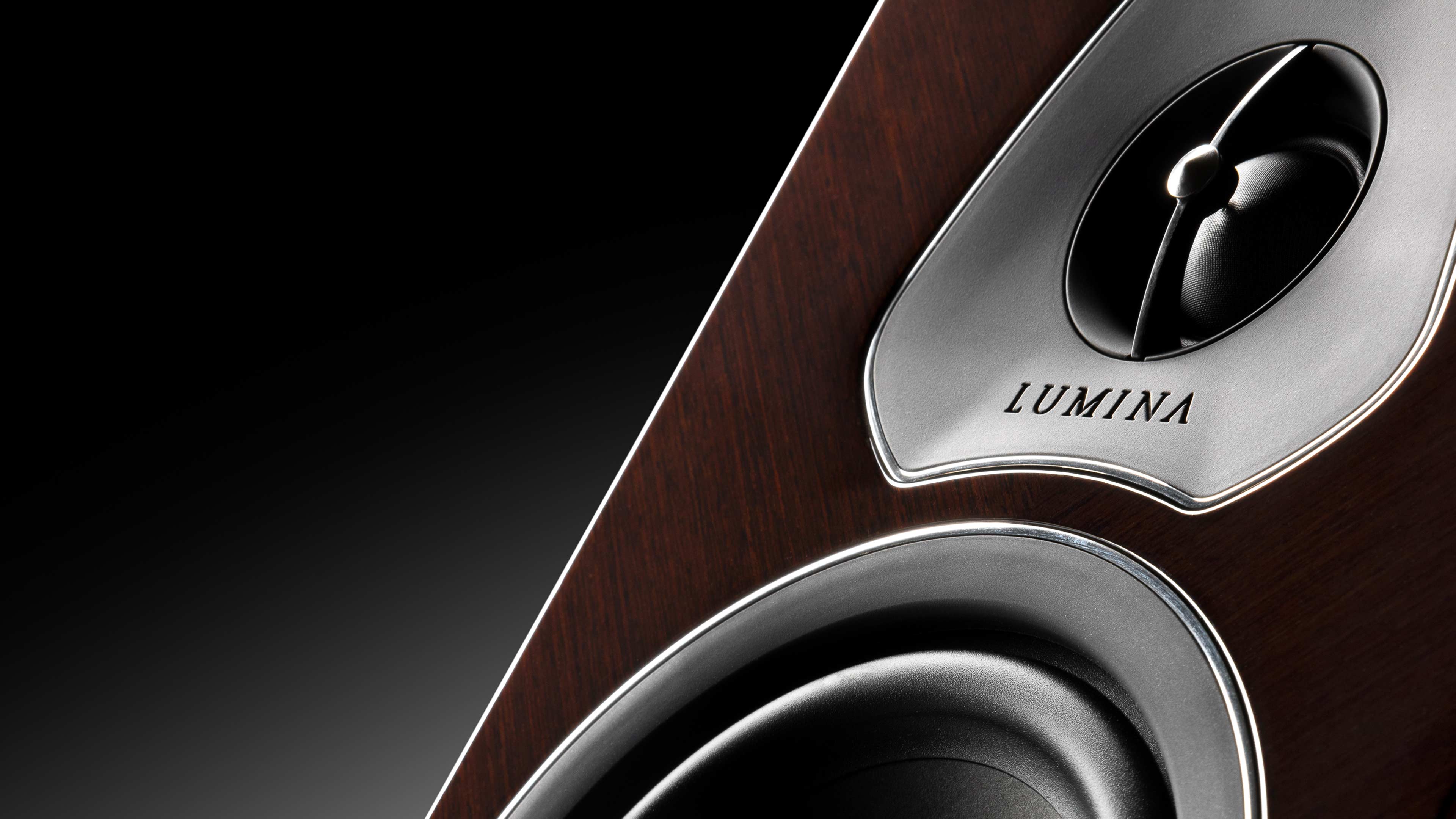 Close-up of a Sonus faber Lumina II Amator speaker in wenge high gloss multilayer wood with black leather accents.