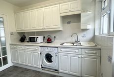 White kitchen with washing machine