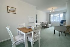 Dining table and sitting room with sofa