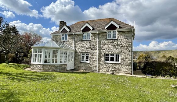 house with large lawned garden