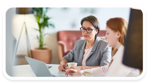 Two women in a consulting session with a laptop.