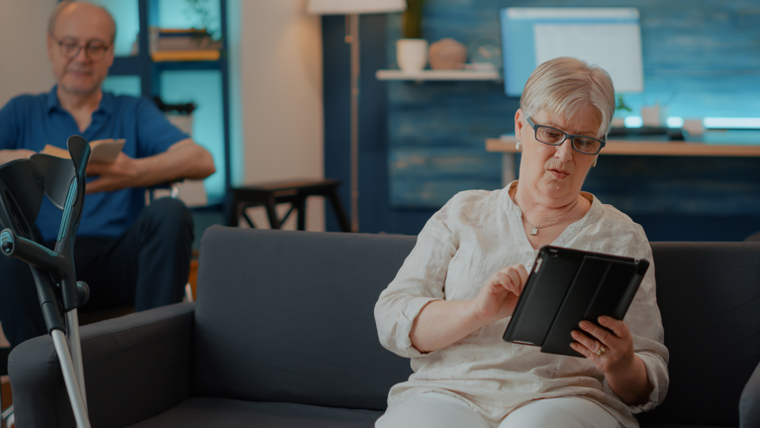 Older adults using a tablet in a modern living space