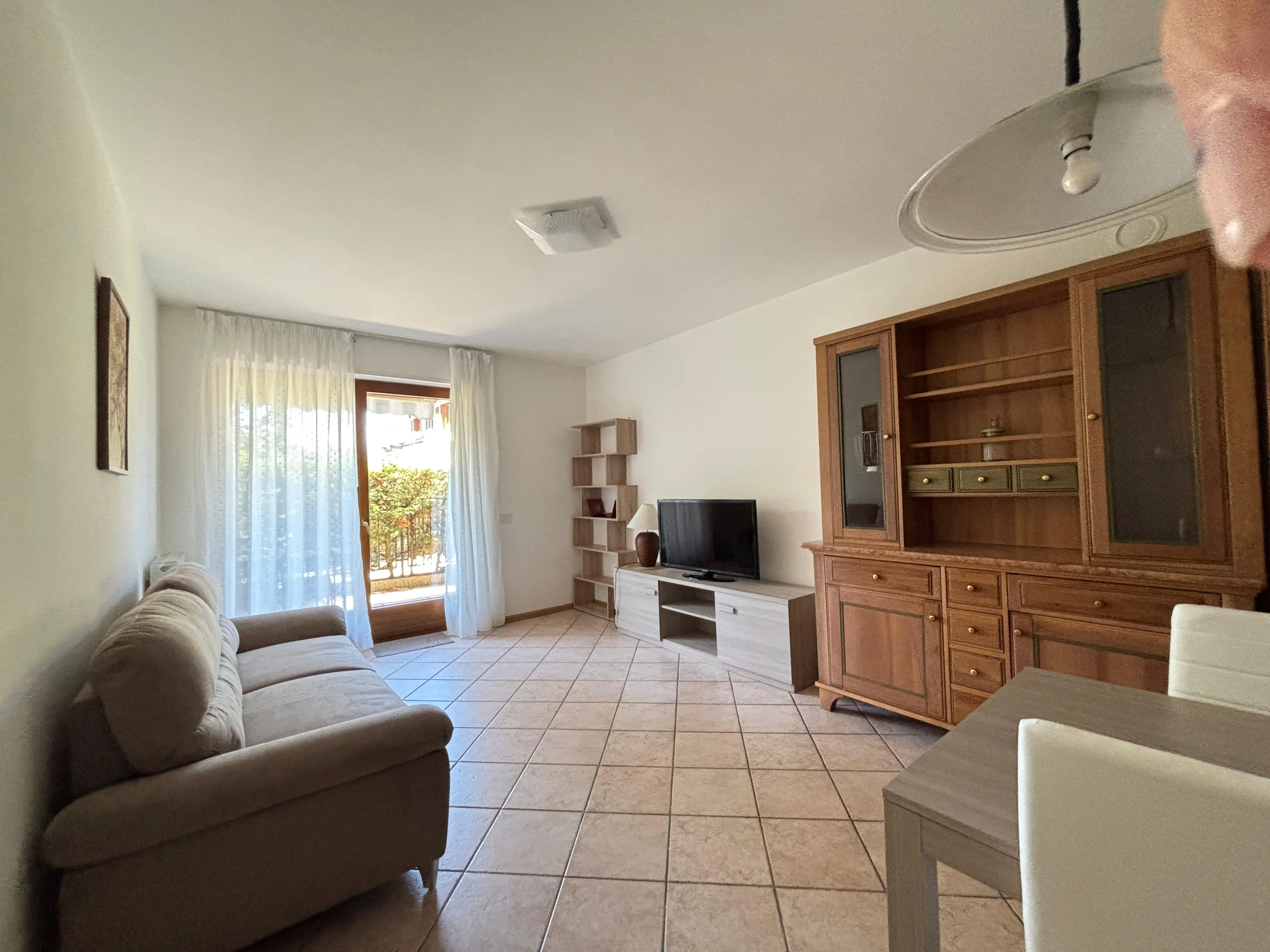 Appartamento arredato con due camere e doppio giardino privato in affitto a Povo