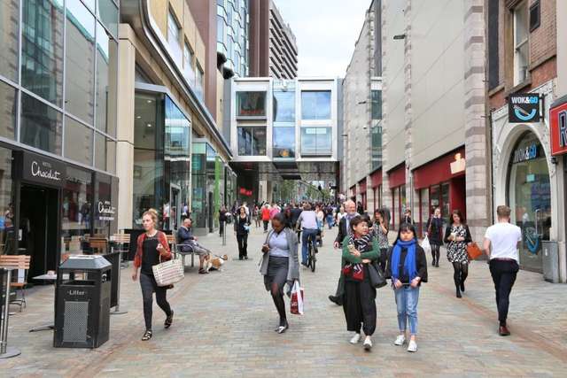 People and students shopping in leeds city centre