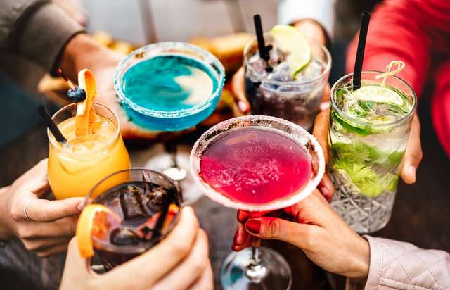 Students toasting a mixture of cocktails