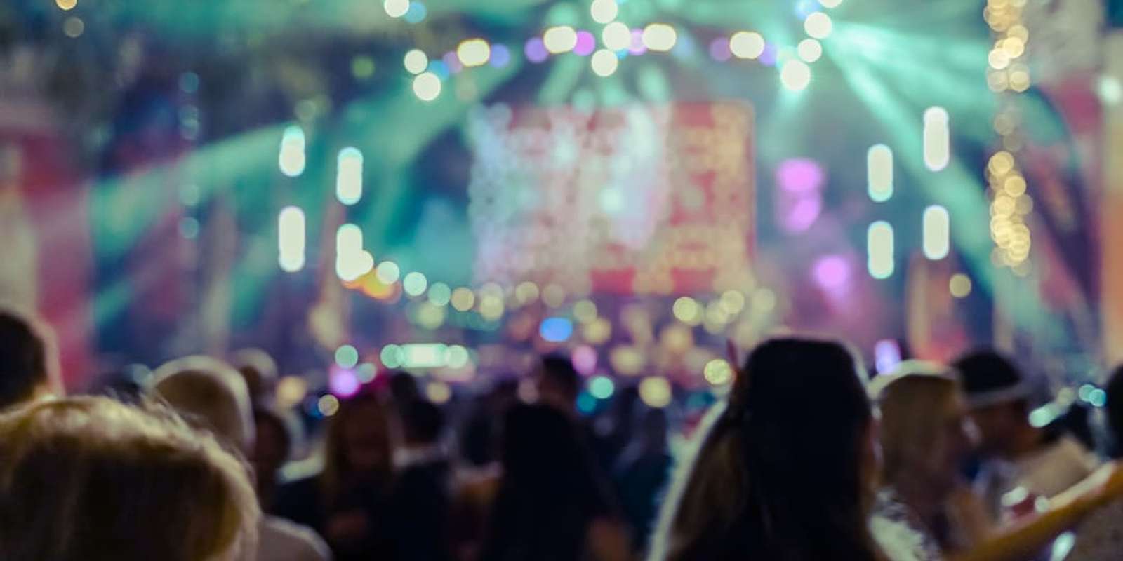 Students partying in a club with rave lights