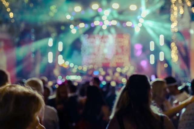 Students partying in a club with rave lights