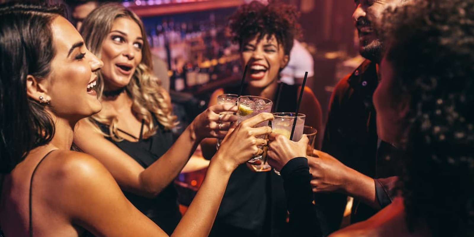 Students in the club toasting with drinks