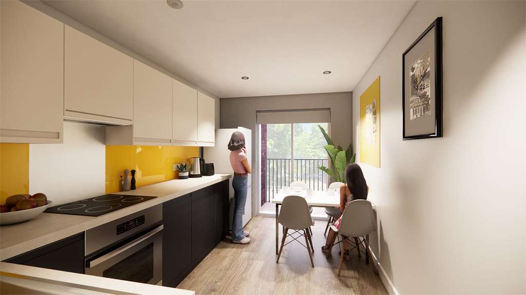 Bright modern galley kitchen with yellow backsplash and balcony; two women, one standing at the counter, one seated at the dining table.