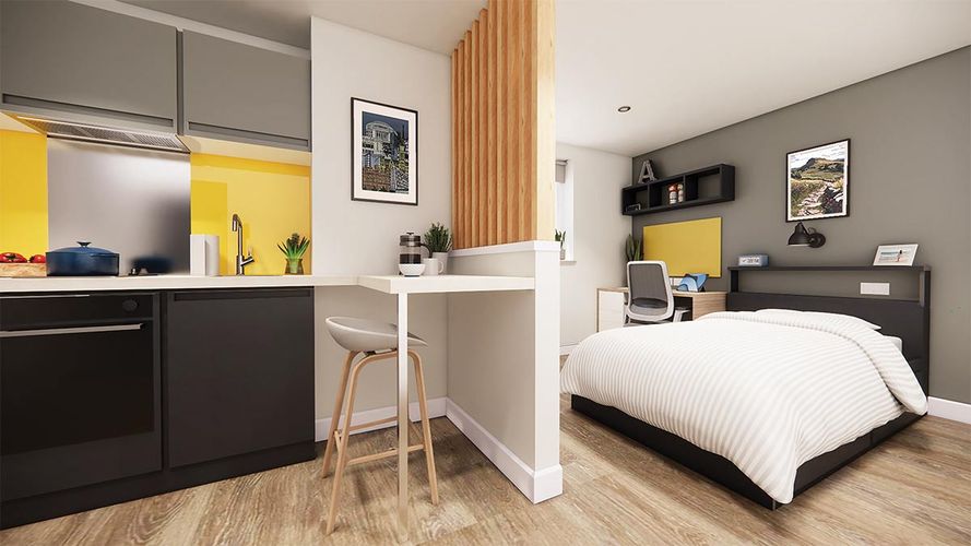 Modern studio apartment with a kitchen, dining area, and bedroom. Features wood flooring, yellow accents, and wall decorations.