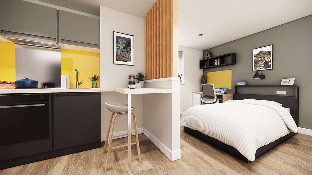 Modern studio apartment with a kitchen, dining area, and bedroom. Features wood flooring, yellow accents, and wall decorations.