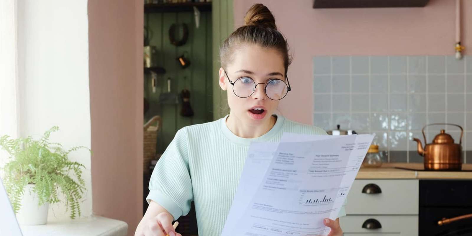 A student looking at her bills