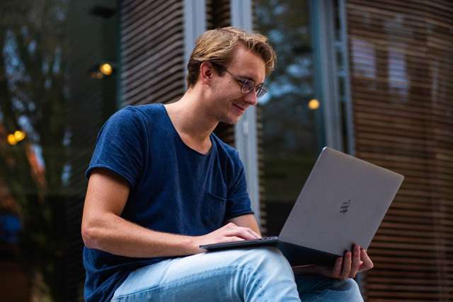 Student using a laptop outside