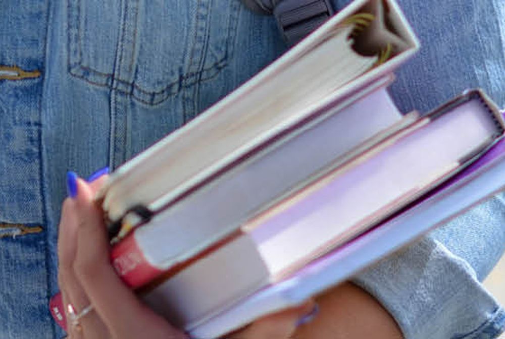 Student holding books