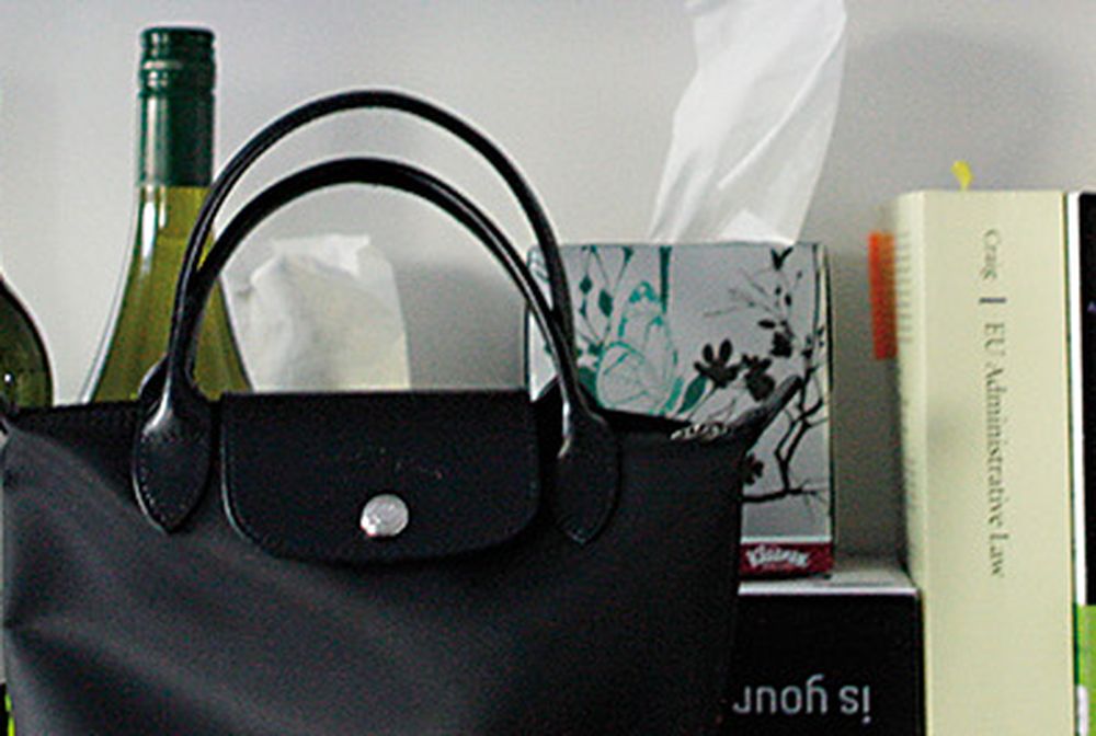 Shelf with wine bottle and books