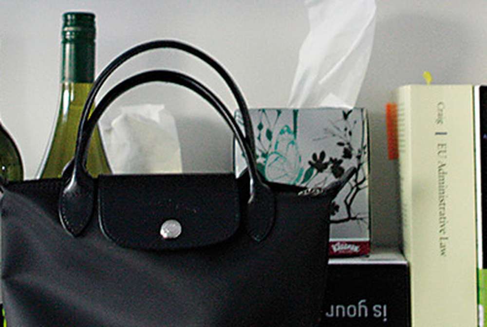 Shelf with wine bottle and books