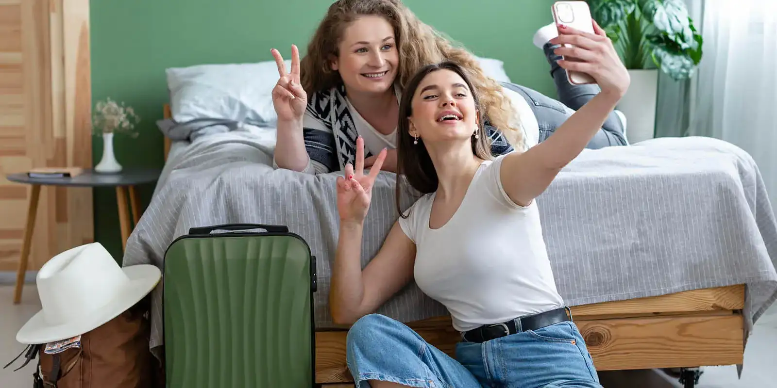 Two female friends taking a selfie on a phone
