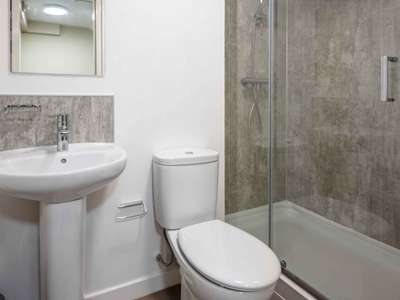 Ensuite bathroom including sink toilet and shower