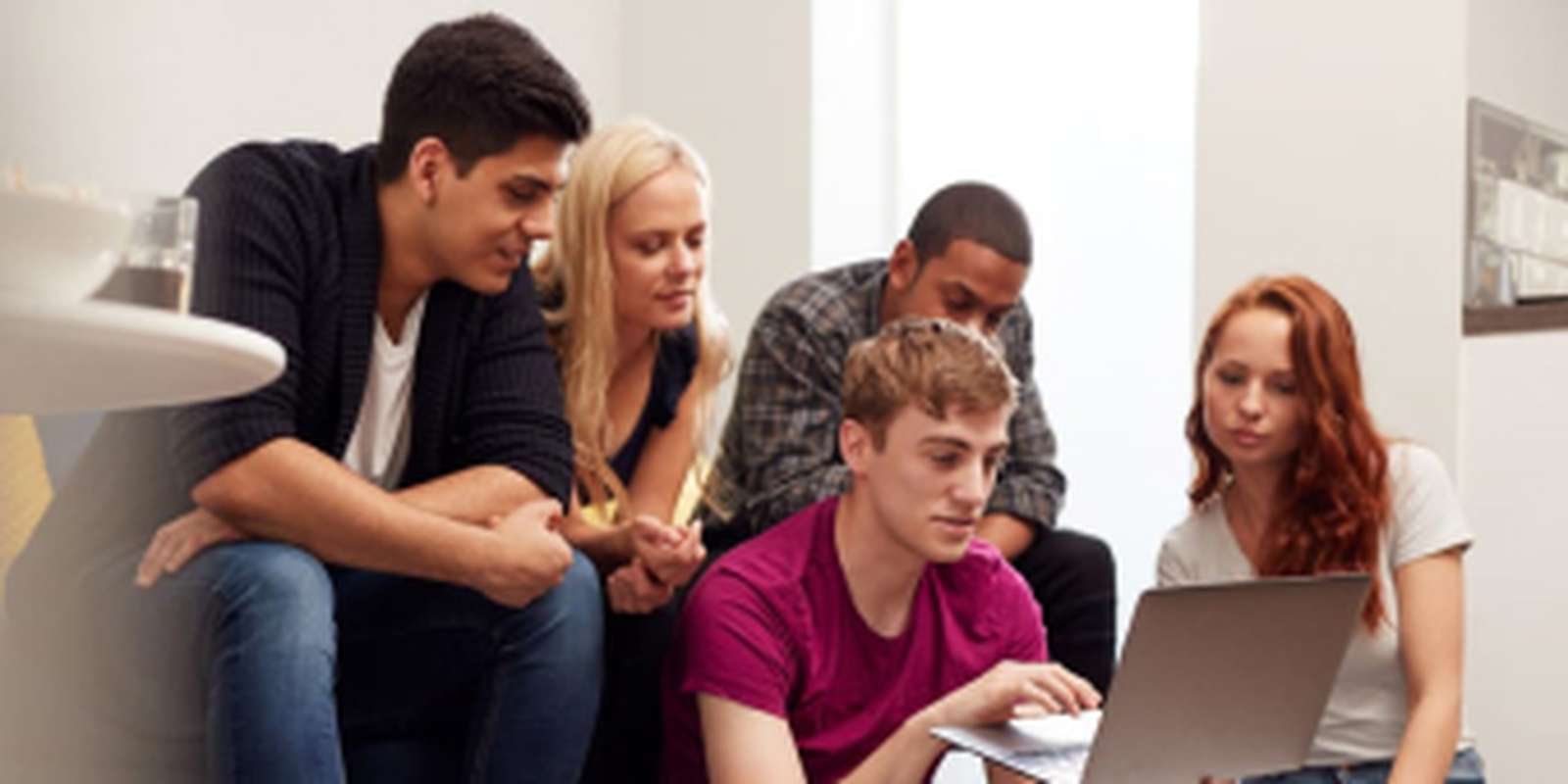 Group of students on a laptop
