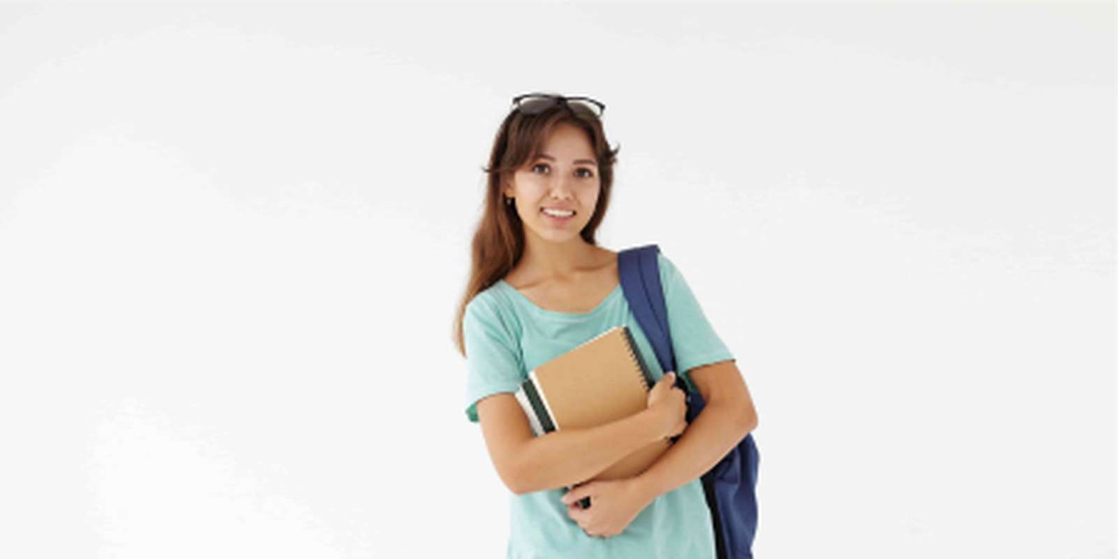 Student holding books and notepads