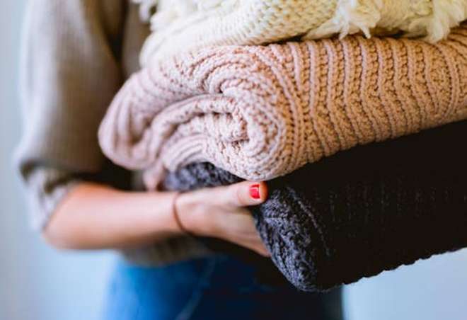 Girl student holding laundry