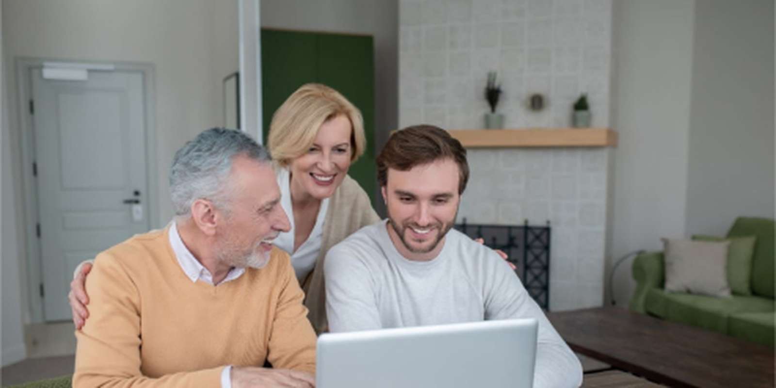 Student on laptop with mum and dad