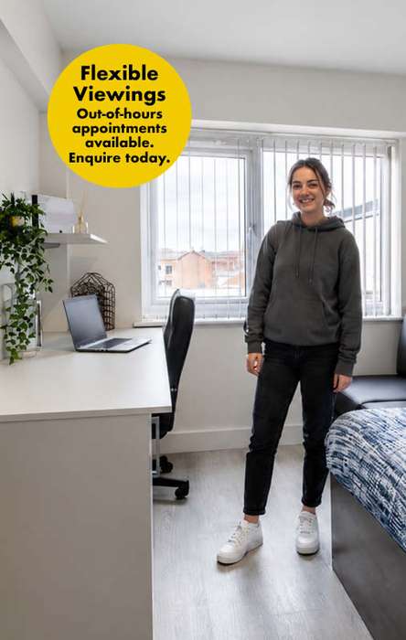 Woman in a bedroom with a bed, desk, and laptop. A sign reads "Flexible Viewings, Out-of-hours appointments available. Enquire today."