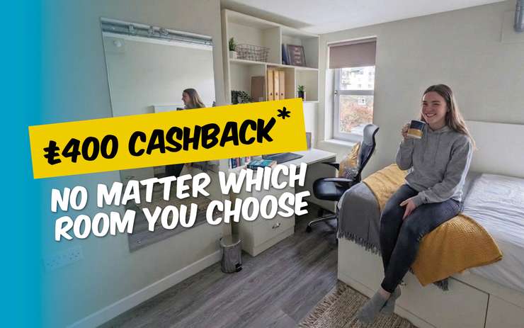 A person sits on a bed in a cozy room holding a mug. Text offers £400 cashback "no matter which room you choose."