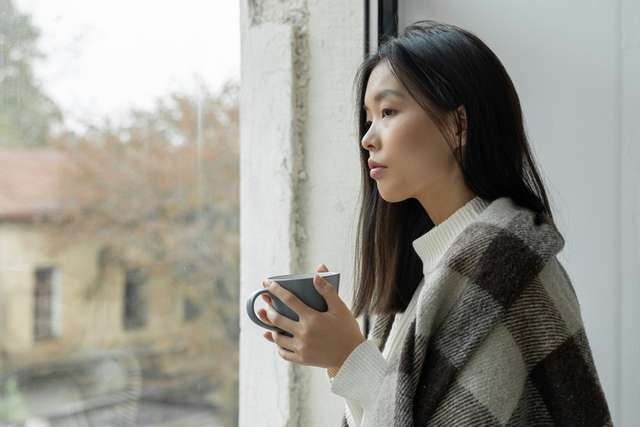 A student looking out of a window