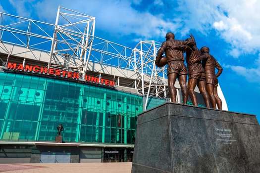 The United Trinity bronze sculpture at Old Trafford stadium in Manchester