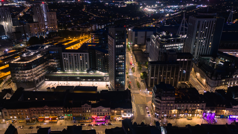 A night time view from the sky of a busy Cardiff street