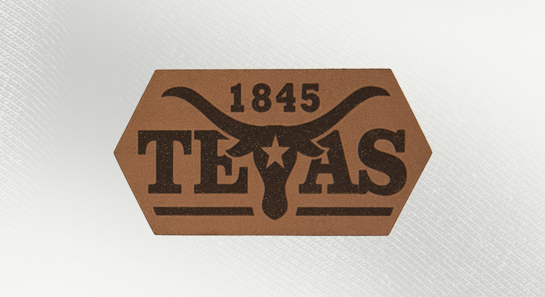 a caramel leather patch with a texas longhorn and the word texas