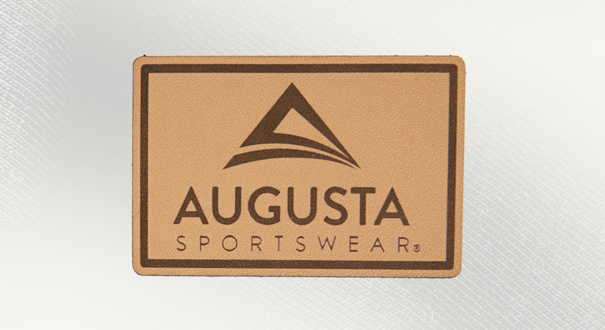 a rectangle natural leather patch with the words augusta sportswear