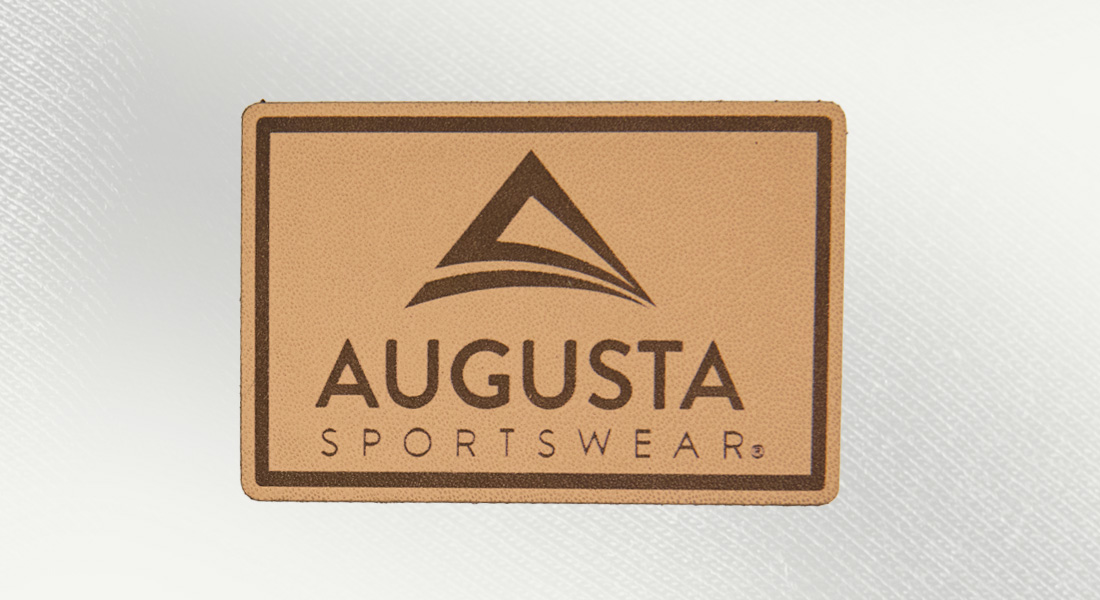 a rectangle natural leather patch with the words augusta sportswear