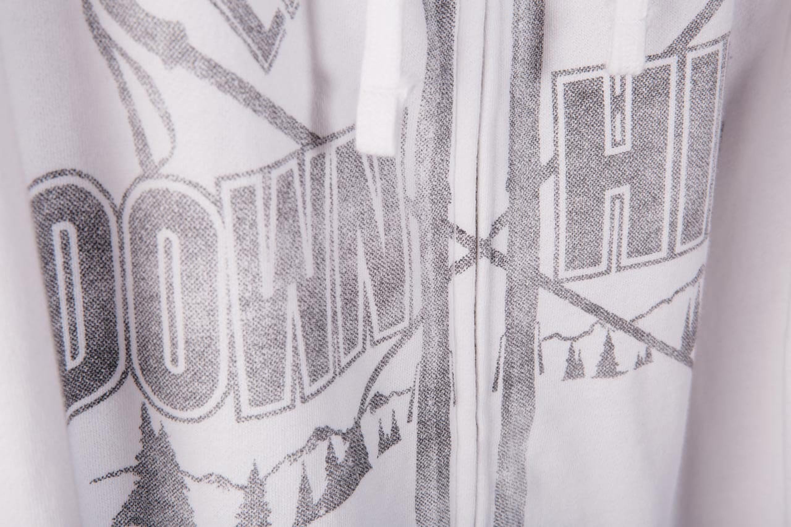 white sweatshirt with gray over the zipper printing 