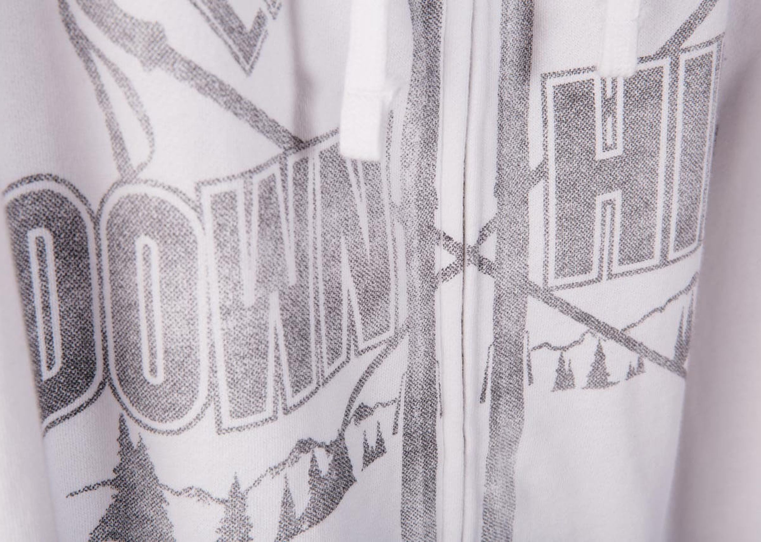 white sweatshirt with gray over the zipper printing 